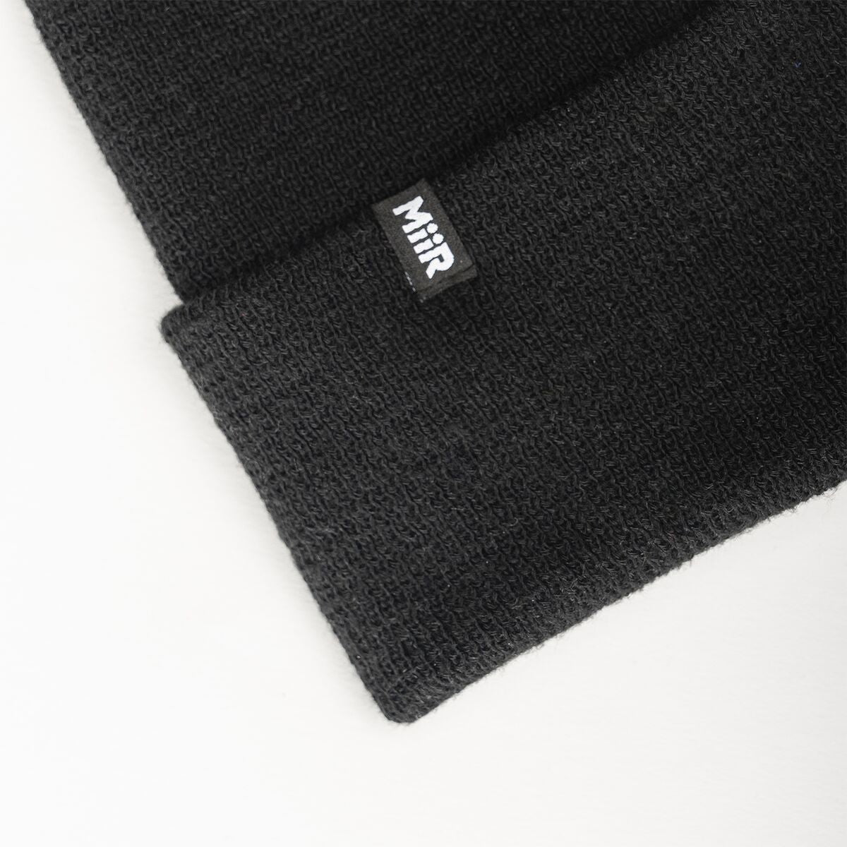 recycled-poly-fine-knit-beanie-f5 WebPDP-RecycledPolyFineKnitBeanie_Studio_TagDetail_Black__BNE005002OS.jpg