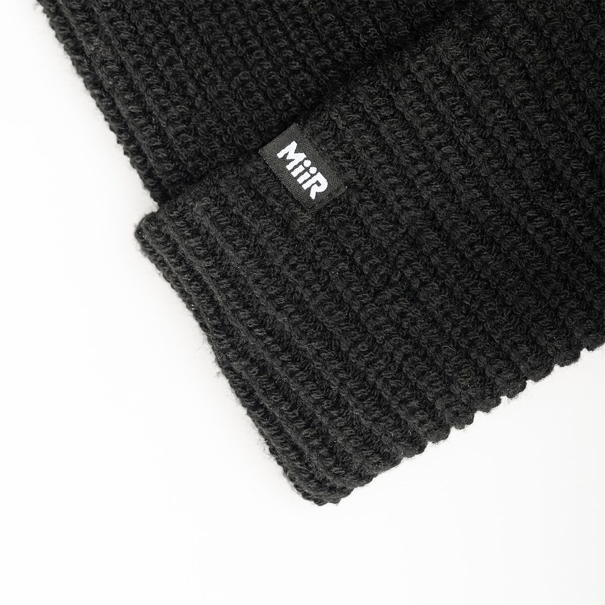 recycled-poly-rib-beanie-c8 WebPDP-RecycledPolyRibBeanie_Studio_TagDetail_Black__BNE002002OS.jpg